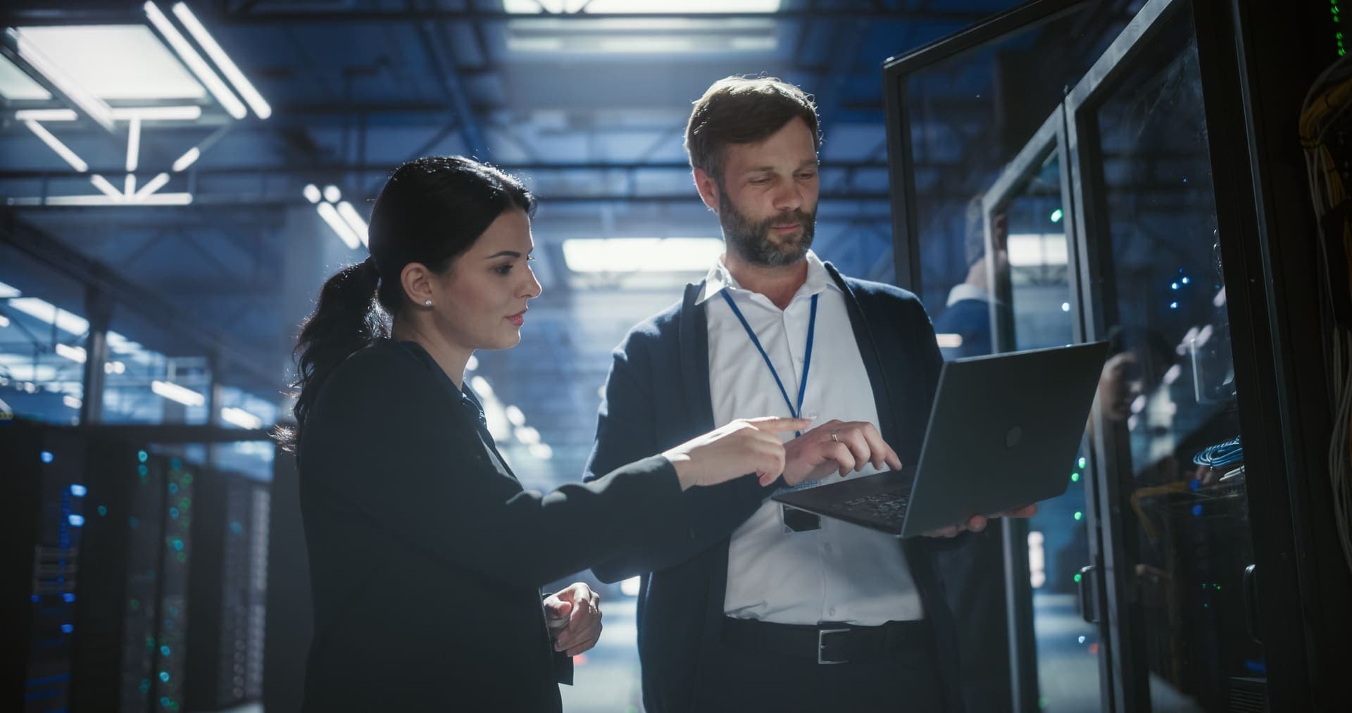 Technicians in a production environment with a tablet