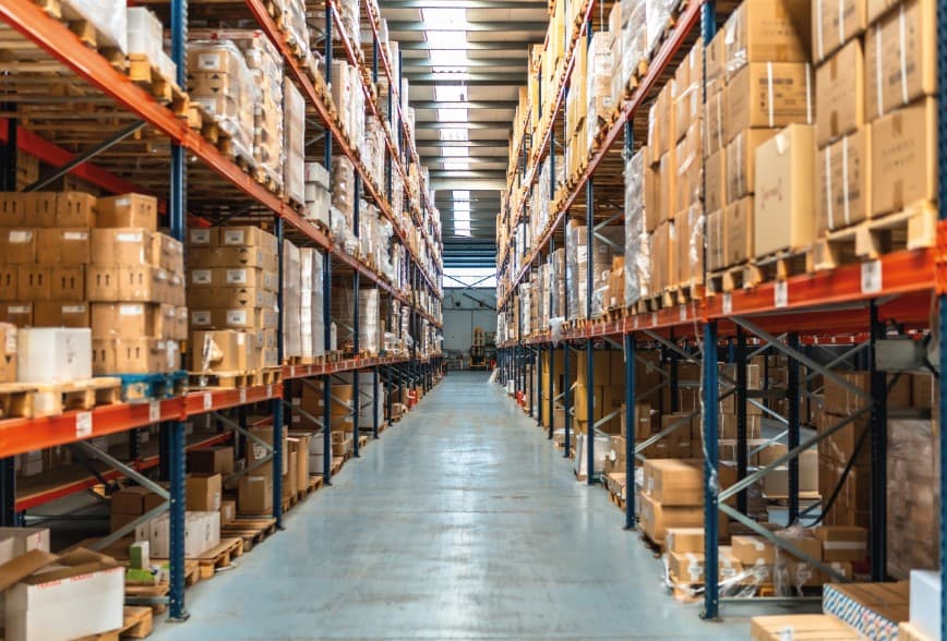 Warehouse with high racks and aisle