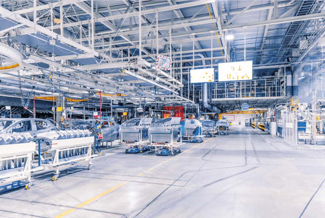 Production hall with assembly line and machine components